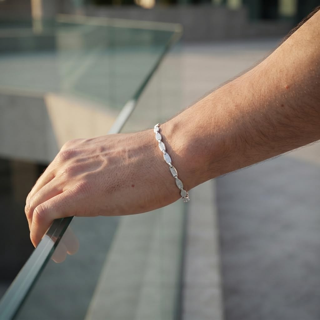 The flat mariner link bracelet for men shown against a plain studio background