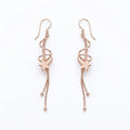 Rose Gold Floating Star Dangle Earrings, front product view