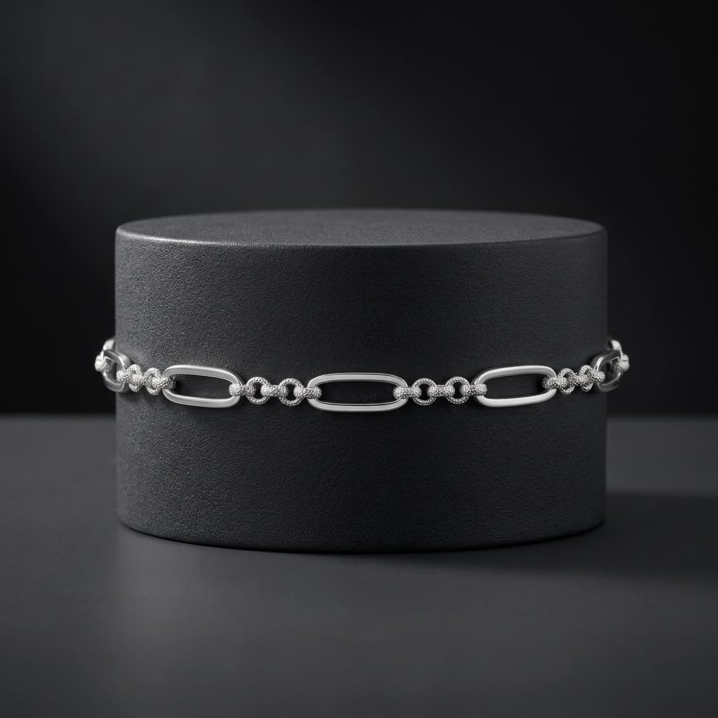 The oval and bead link bracelet for men shown against a plain studio background