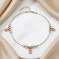 Styled view of the Silvme rose-gold CZ bell charm 925 sterling silver anklet for women