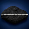 The slim textured link bracelet for men shown against a plain studio background