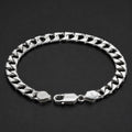 Close-up of a solid flat curb chain with a wide, level face on the Silvme solid flat curb chain bracelet