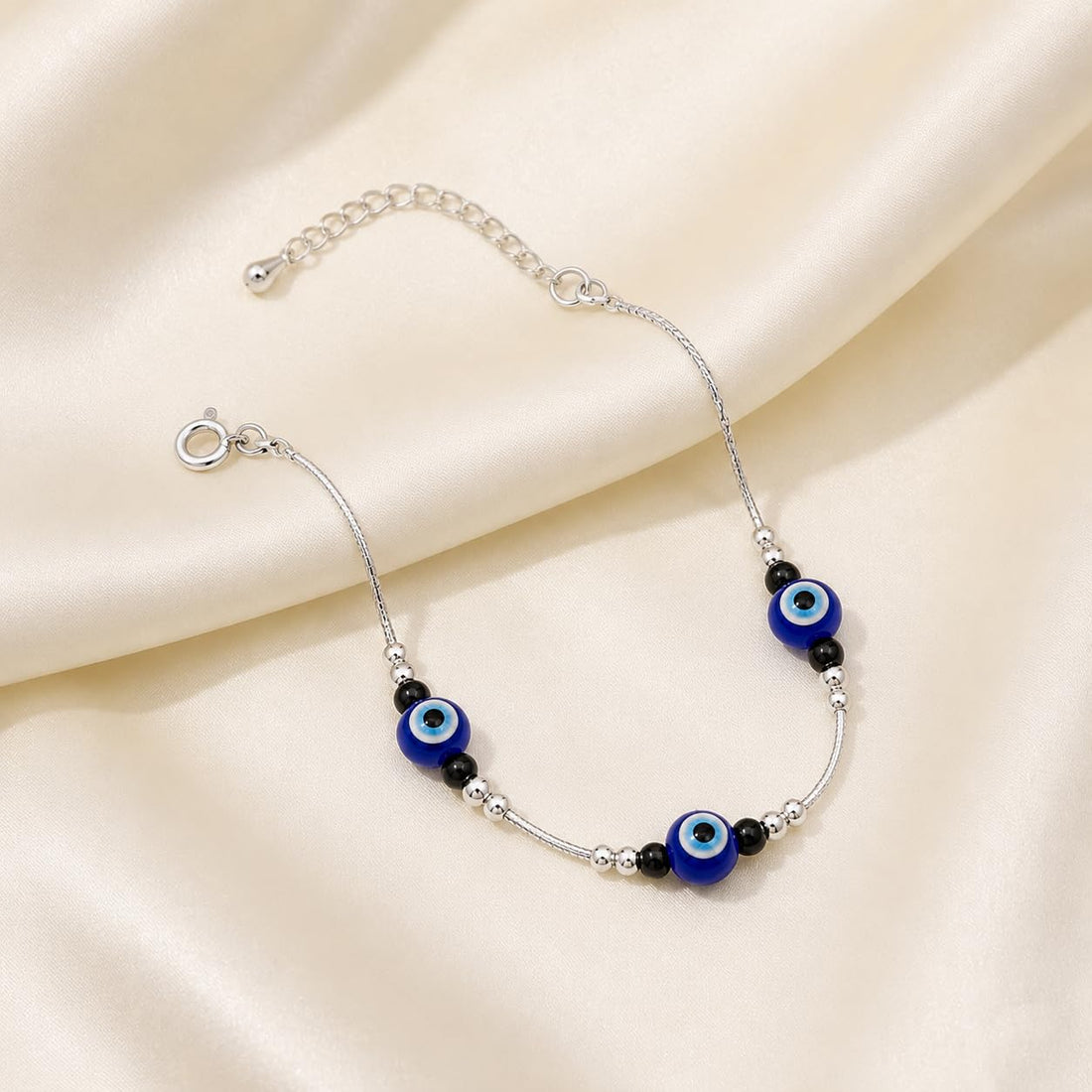 Silvme 925 sterling silver evil eye & black bead cluster anklet with a blue evil-eye and black-bead cluster, white background full view
