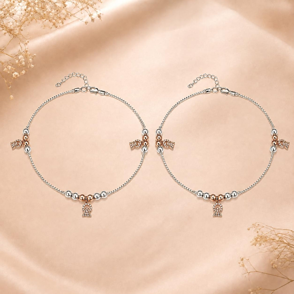 Charm, bead and chain detail on the Silvme rose-gold CZ bell charm 925 silver anklet payal