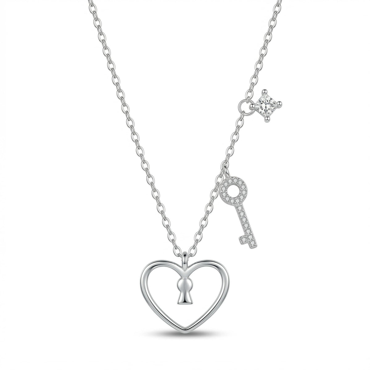A silver necklace featuring a heart-shaped pendant with a keyhole in the center, a dangling key charm, and a small star-shaped accent, shown on a clean white background.