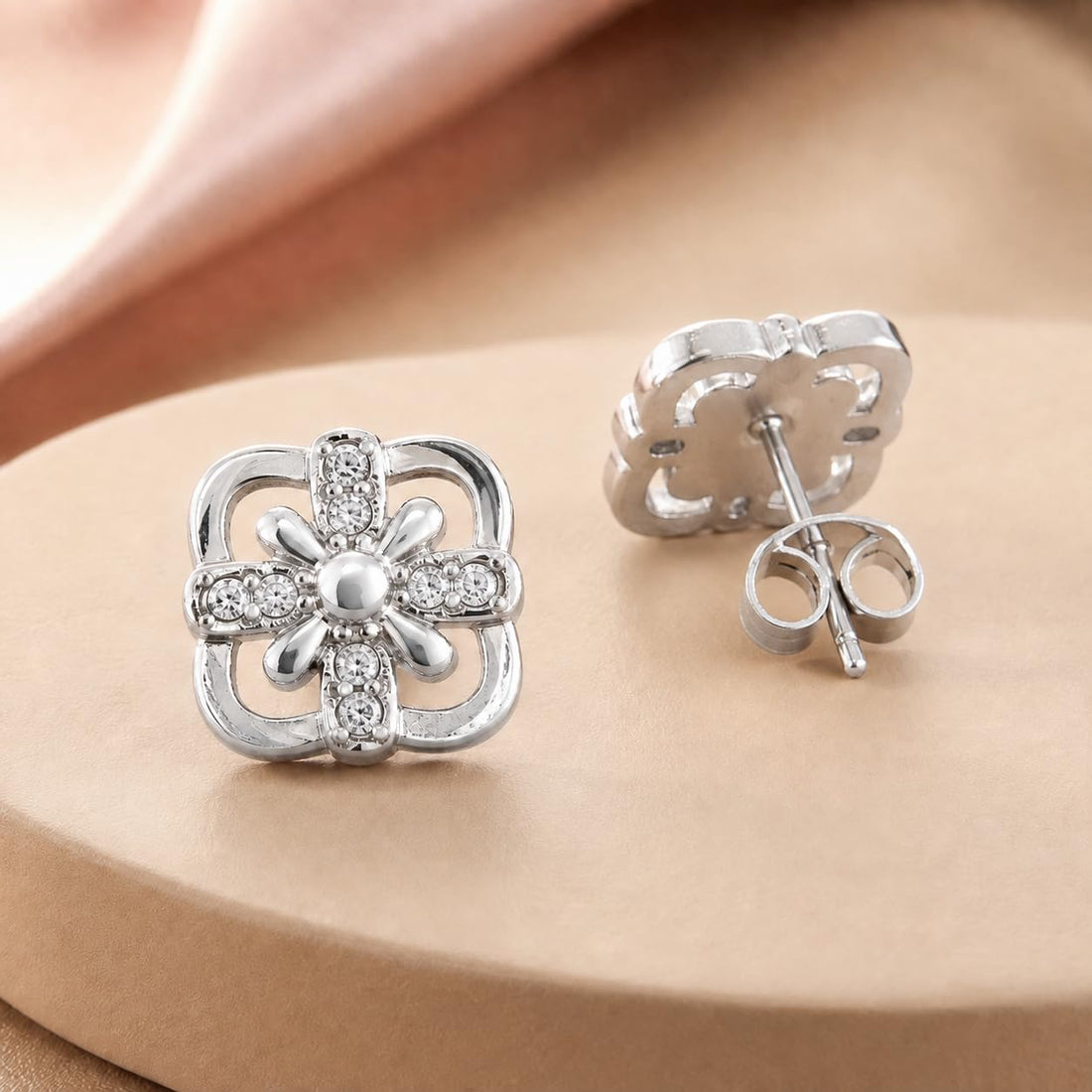 Floral 925 silver stud earrings for women, festive gift, shown as a matching pair