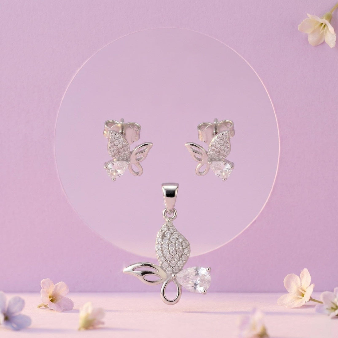 Silvme pure 925 sterling silver pink butterfly pendant and stud earrings set with pink cubic zirconia, front view on white background
