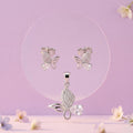 Pink Butterfly 925 sterling silver pendant and stud earrings jewellery set with pink cubic zirconia by Silvme â€” angled studio view