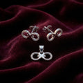 Silvme 925 silver ribbon bow pendant and stud earrings with cubic zirconia, close-up detail