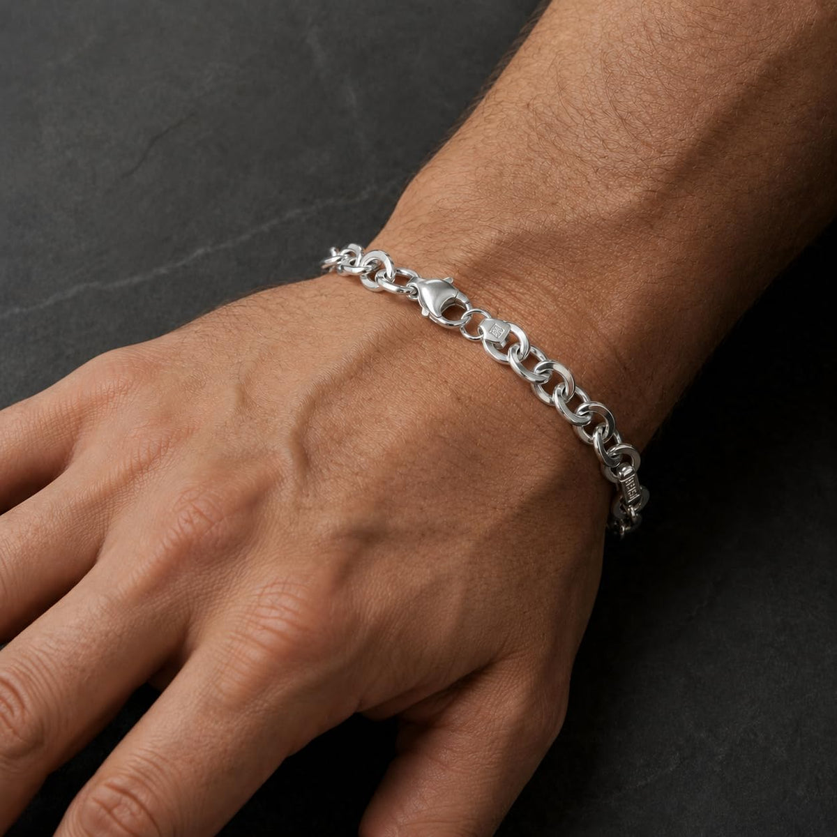 Full length of the greek key mariner bracelet showing its polished silver-tone finish