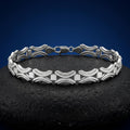 Full length of the open arc link bracelet showing its polished silver-tone finish
