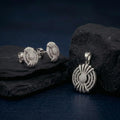 Starburst Medallion 925 sterling silver pendant and stud earrings jewellery set with cubic zirconia by Silvme â€” angled studio view