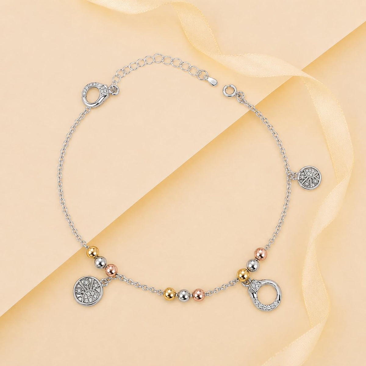 Charm, bead and chain detail on the Silvme tree of life tri-tone charm 925 silver anklet payal