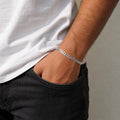 Link pattern and surface detail across the solid flat curb chain bracelet by Silvme