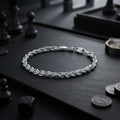 The twisted rope chain bracelet for men shown against a plain studio background