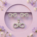 Silvme 925 silver infinity pendant and stud earrings with cubic zirconia, close-up detail
