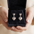 Double Puffed Heart Drop 925 silver drop stud earrings for women, evening wear, further studio view