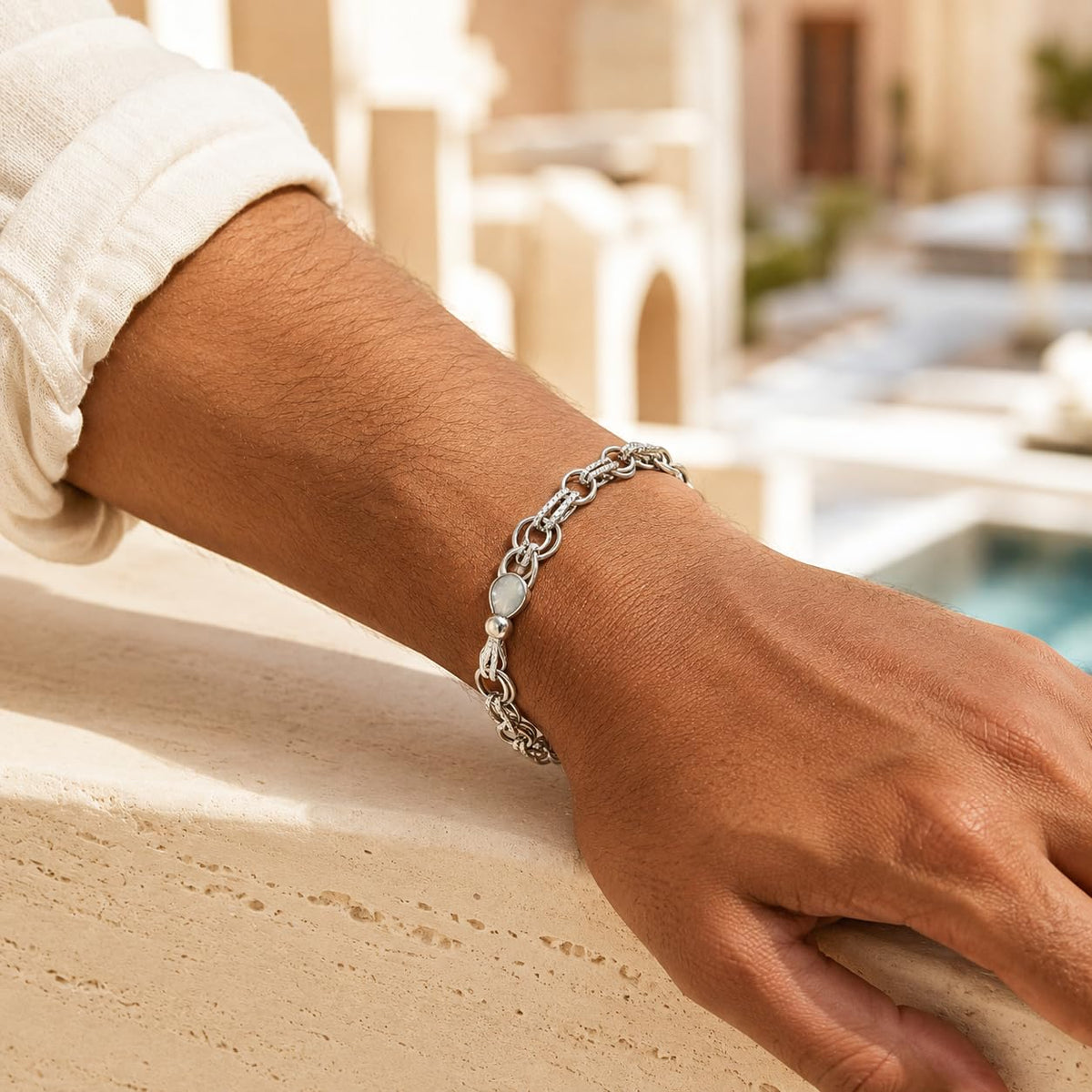 Full length of the fine rolo chain bracelet showing its polished silver-tone finish