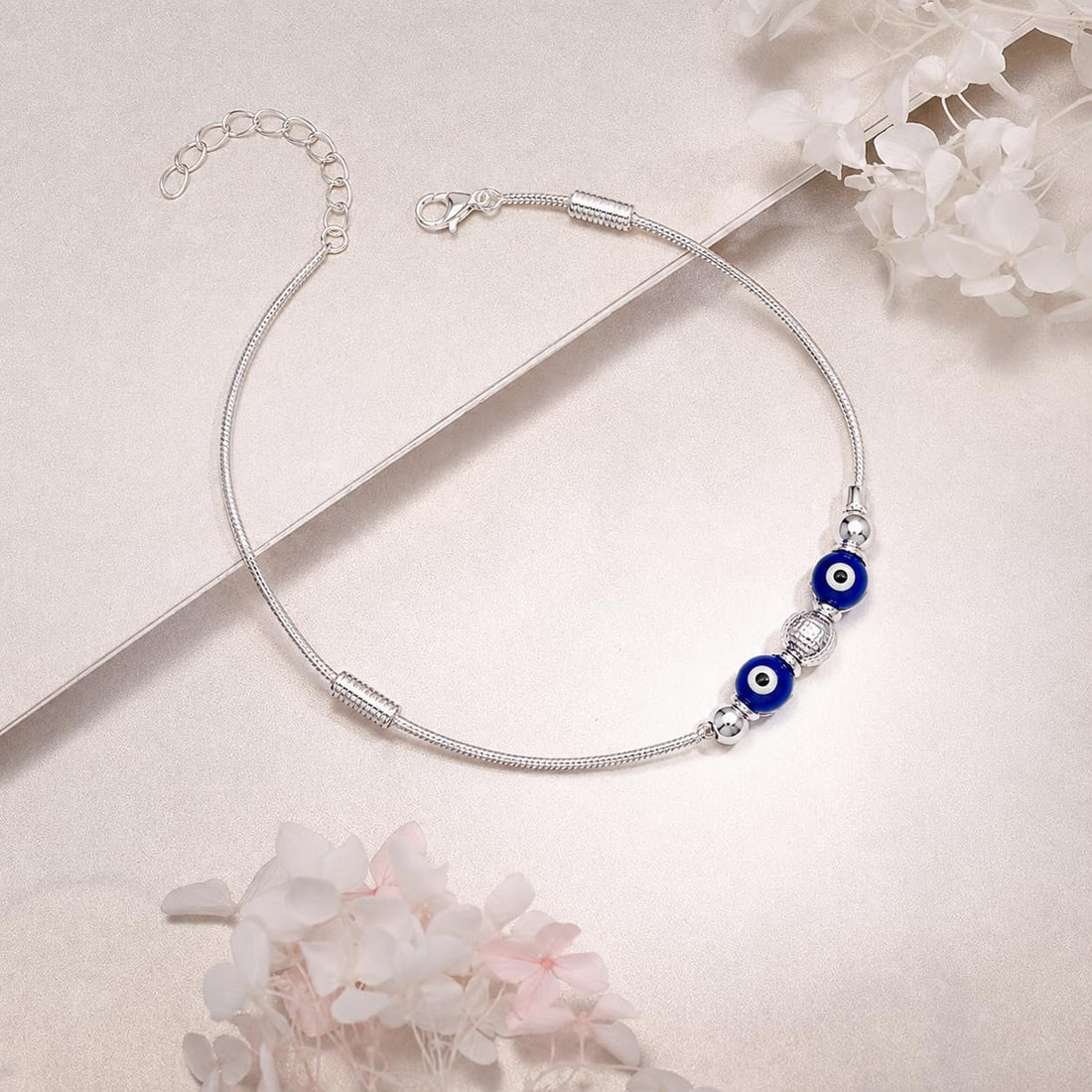 Silvme 925 sterling silver blue evil eye snake chain anklet with twin blue evil-eye beads on a snake chain, white background full view