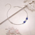 Silvme blue evil eye snake chain 925 silver anklet with twin blue evil-eye beads on a snake chain, full-length view