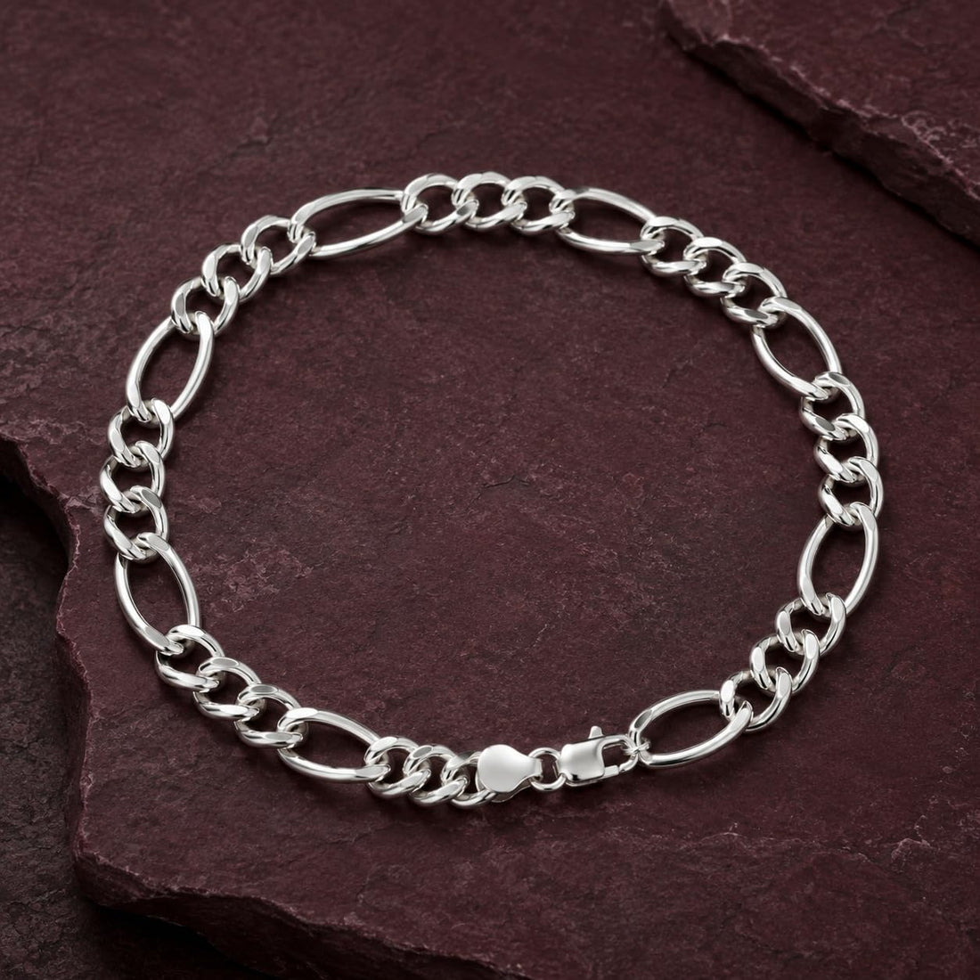 Silvme 925 sterling silver figaro chain bracelet for men shaped into an oval on a white background