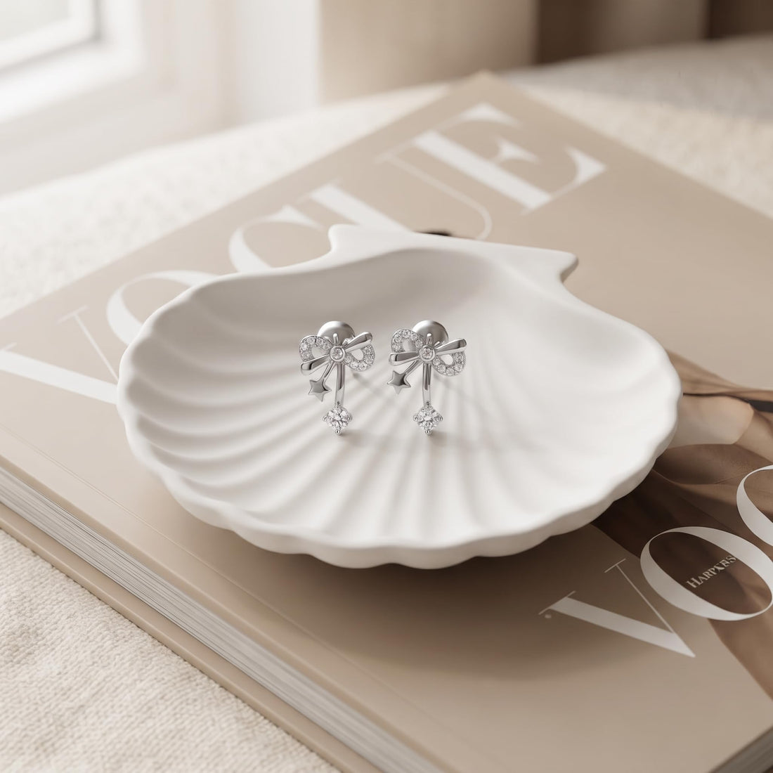 Bow & Star 925 silver stud earrings for women, gift for daughter, shown as a matching pair