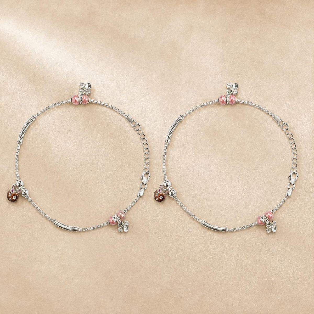 Close-up of pink beads and rose-gold floral CZ charms on the Silvme 925 sterling silver pink bead & rose-gold floral anklet