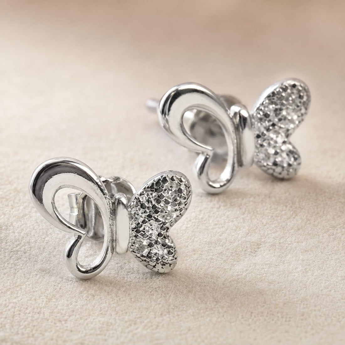 Butterfly 925 silver stud earrings for women, birthday gift, shown as a matching pair