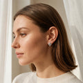 Black Swirl Leaf 925 silver stud earrings for women, everyday wear, styled on fabric