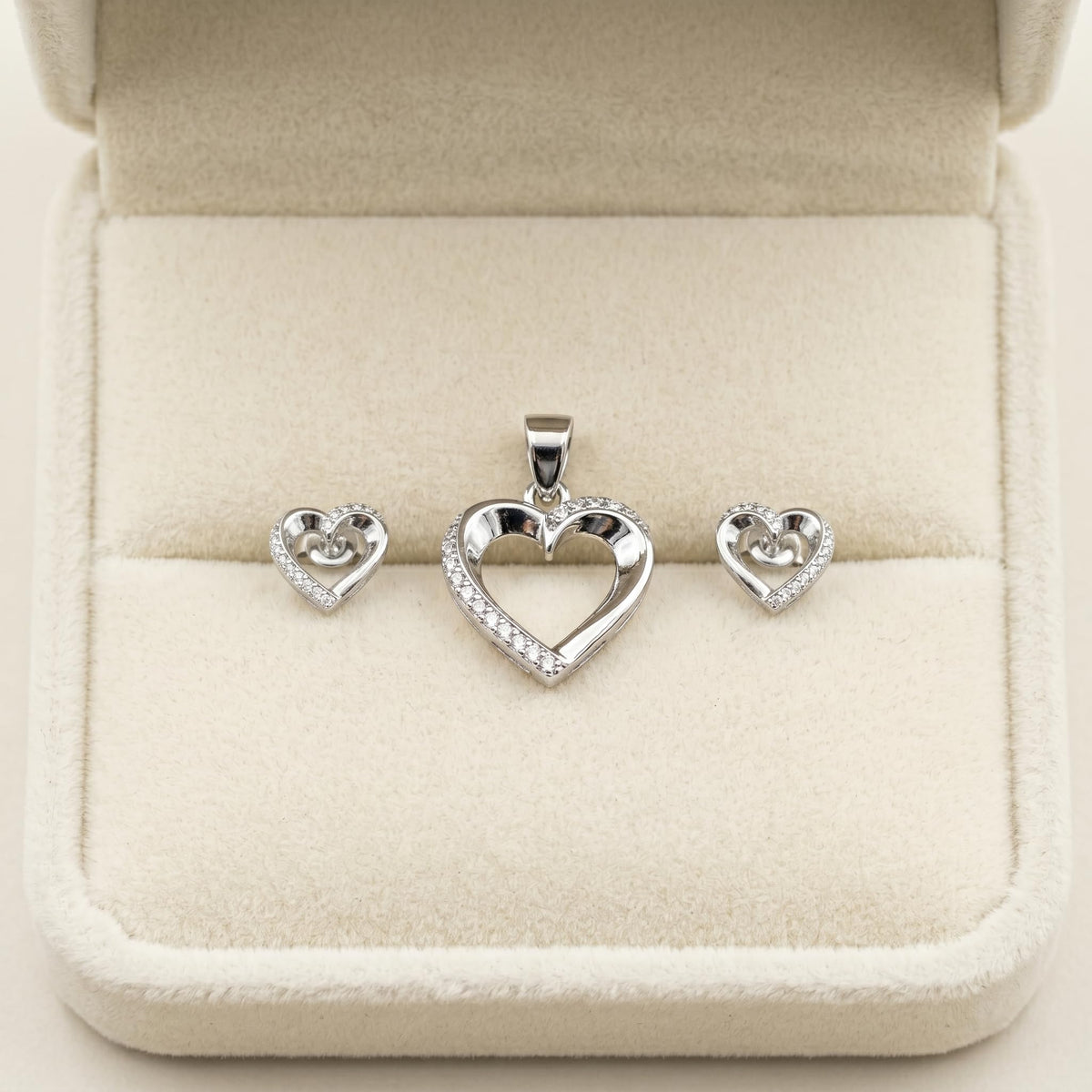 Silvme 925 silver dainty heart pendant and stud earrings with cubic zirconia, styled lifestyle image