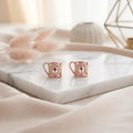 Openwork Mug Charm 925 silver stud earrings for women, gift for sister, angled studio view