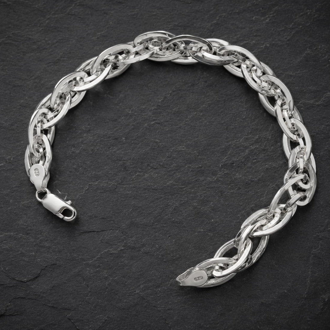 Silvme 925 sterling silver interlocked twist link bracelet for men curved on a white background