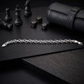 Close-up of a fine rolo chain kept deliberately understated on the Silvme fine rolo chain bracelet