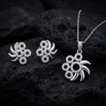 Silvme pure 925 sterling silver pinwheel pendant and stud earrings set with cubic zirconia, styled setting image