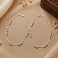 Silvme 925 sterling silver Cream Tube & Black Bead Evil Eye anklet, shown with the chain laid open