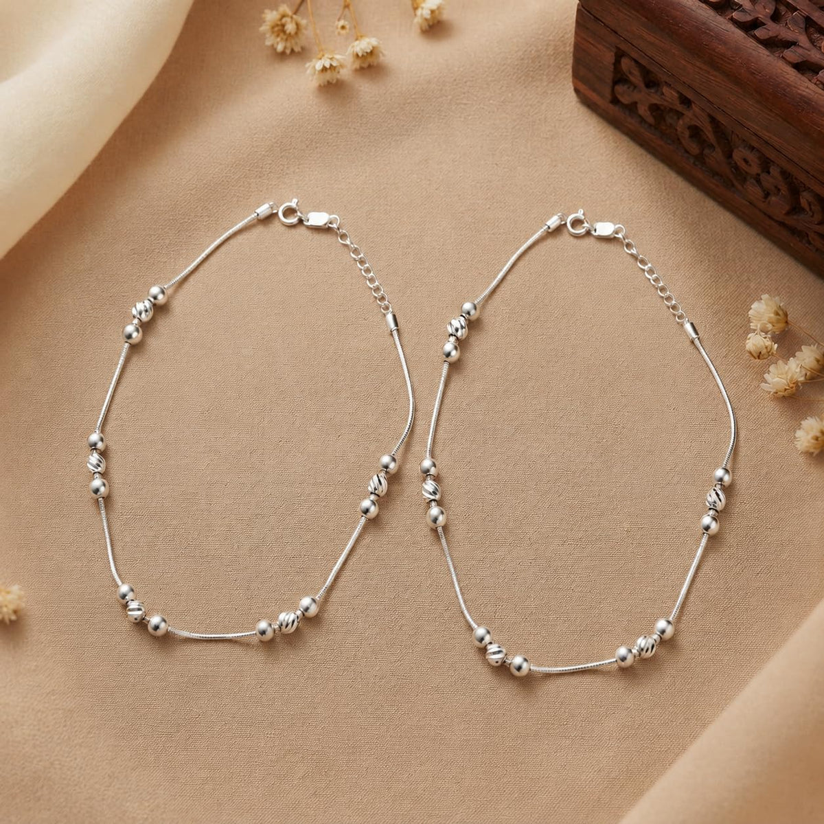 Silvme 925 sterling silver Cream Tube & Black Bead Evil Eye anklet, shown with the chain laid open