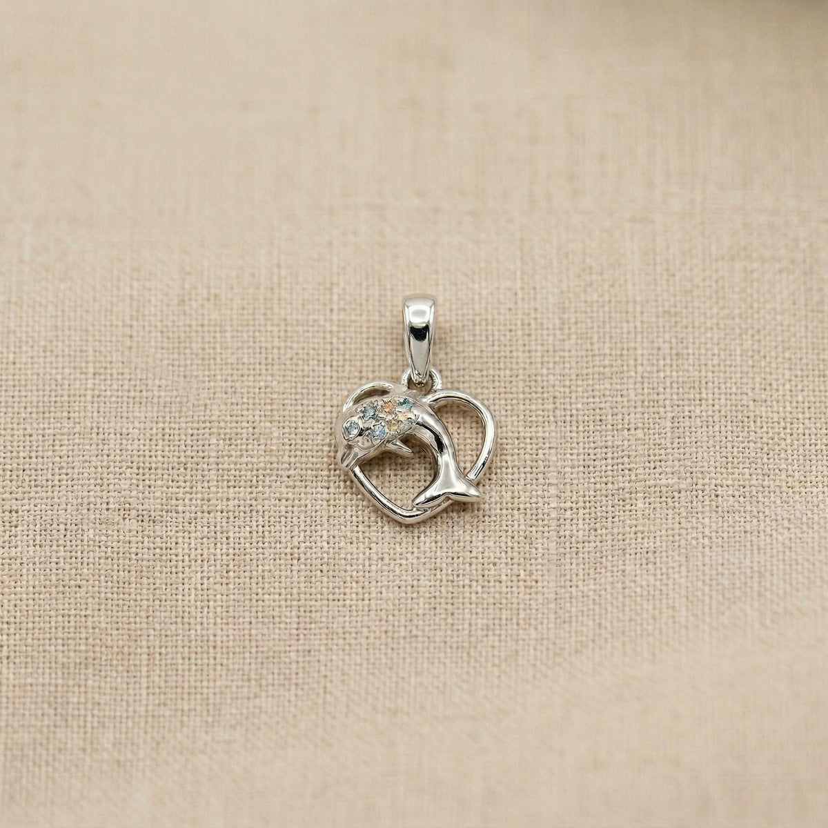 Smooth polished silver surface of the Silvme Dolphin Heart Pendant, premium 925 sterling silver