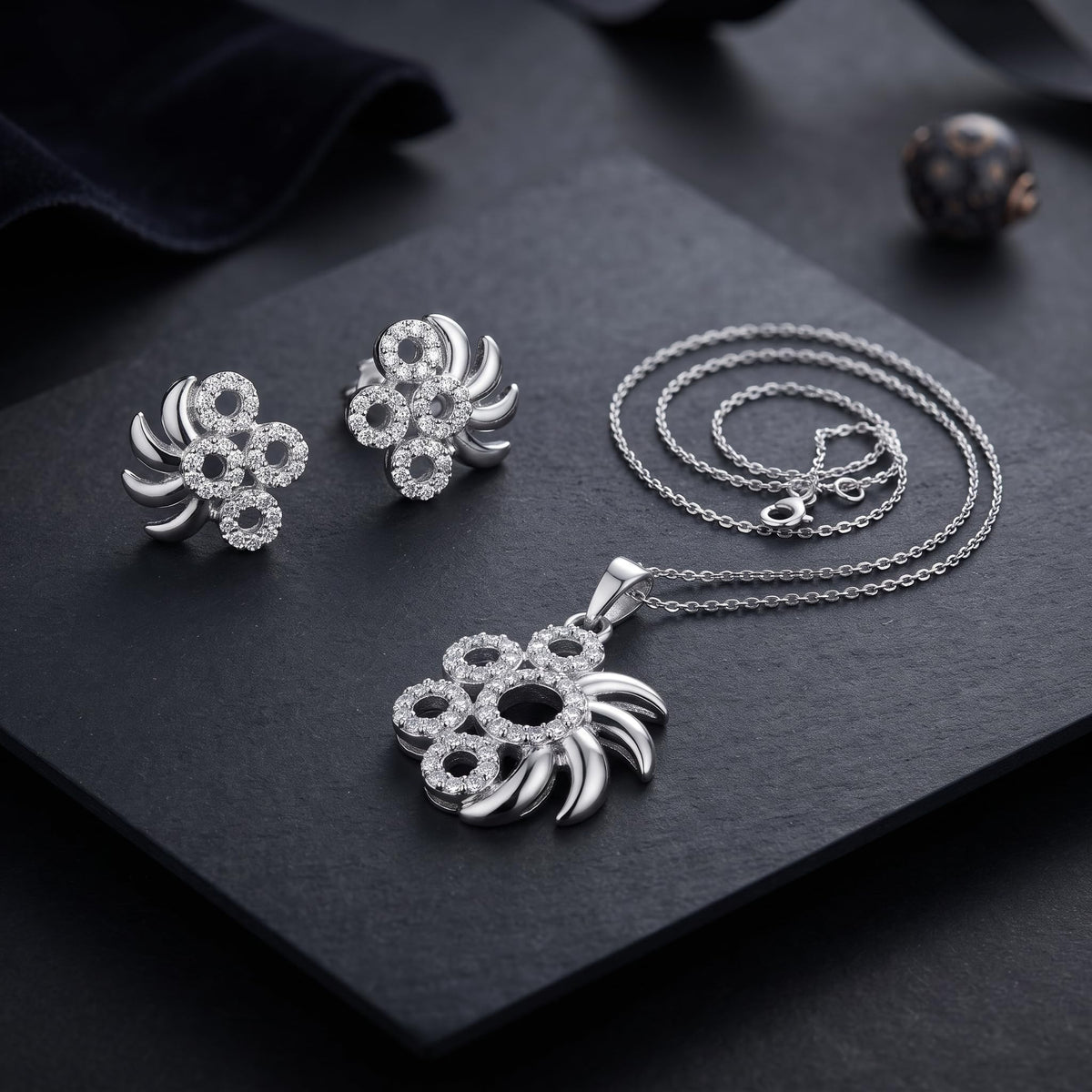 Silvme 925 silver pinwheel pendant and stud earrings with cubic zirconia, model styling view