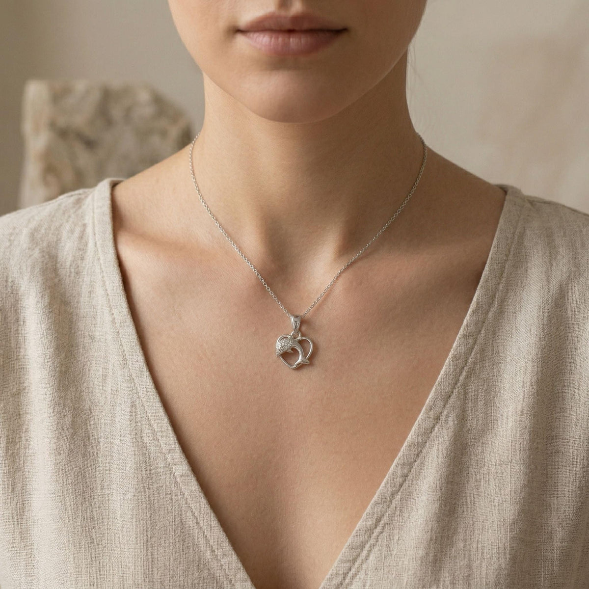 Detailed dolphin heart styling on the Silvme Dolphin Heart Pendant in polished 925 silver, a graceful gift for her