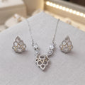 Silvme pure 925 sterling silver cubic zirconia pendant necklace and stud earrings set with cubic zirconia, matching earrings close-up