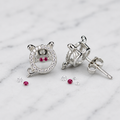 Purple-Centre Spiral Stud Earrings, close-up detail