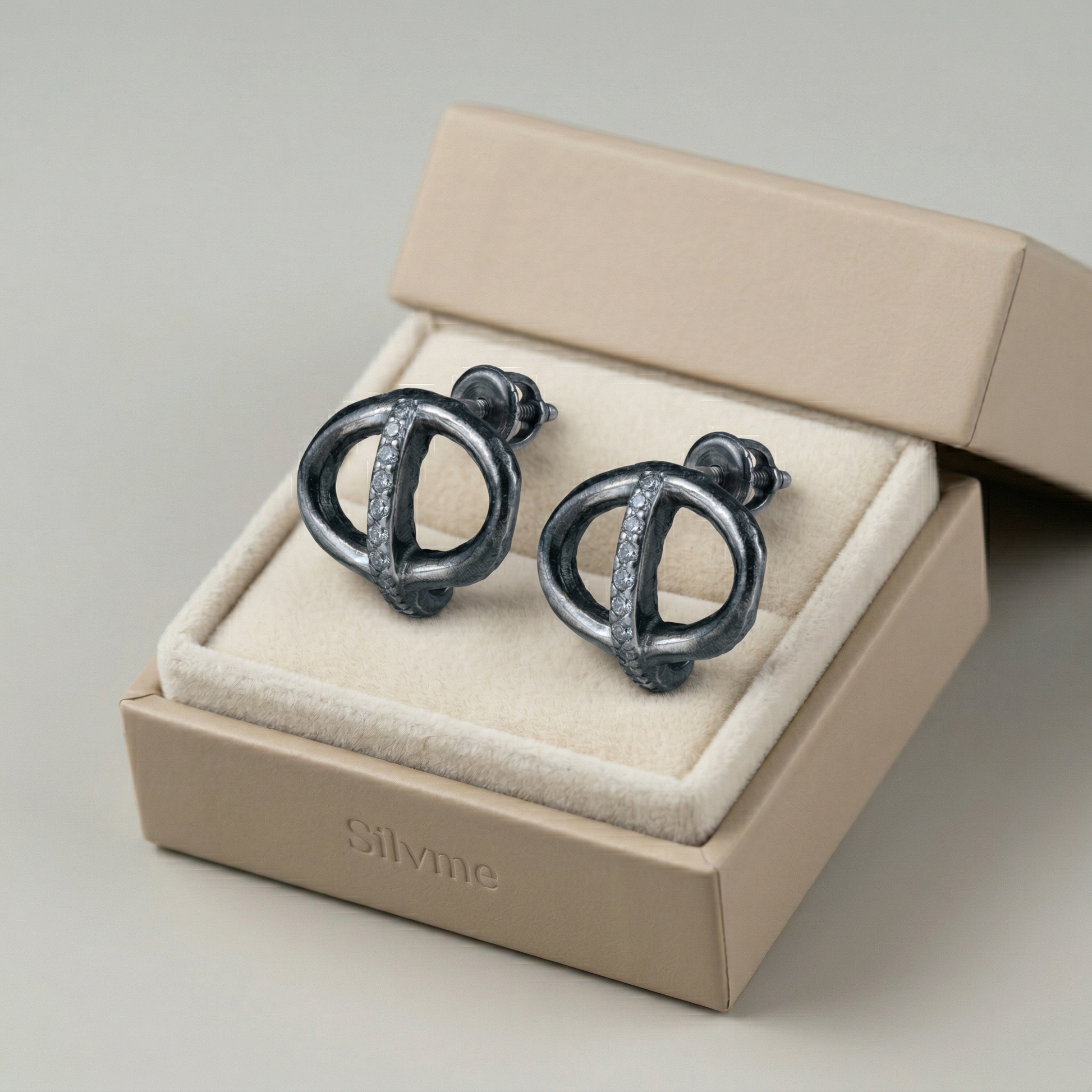 Interlocking Circle Stone-Set Stud Earrings, close-up detail