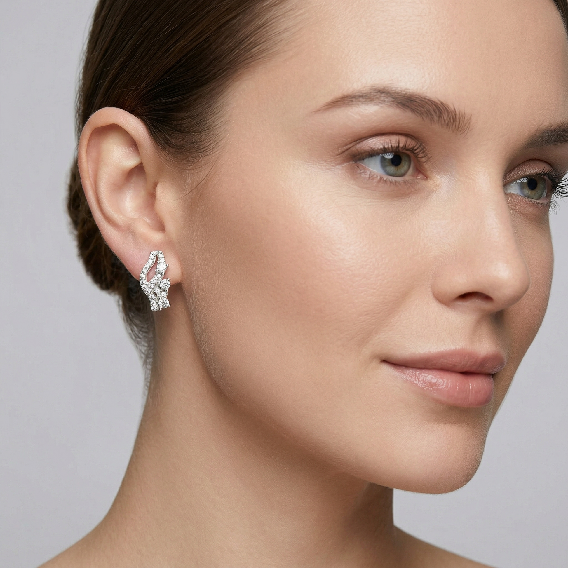 Curved PavÃ© Stone-Set Stud Earrings, close-up detail