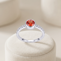 Silvme Orange-Red Bezel Solitaire 925 sterling silver ring for women set with cubic zirconia — studio detail shot