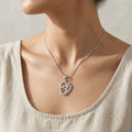 Detailed om pendant styling on the Silvme OM Pendant in polished 925 silver for women, refined silver accessory