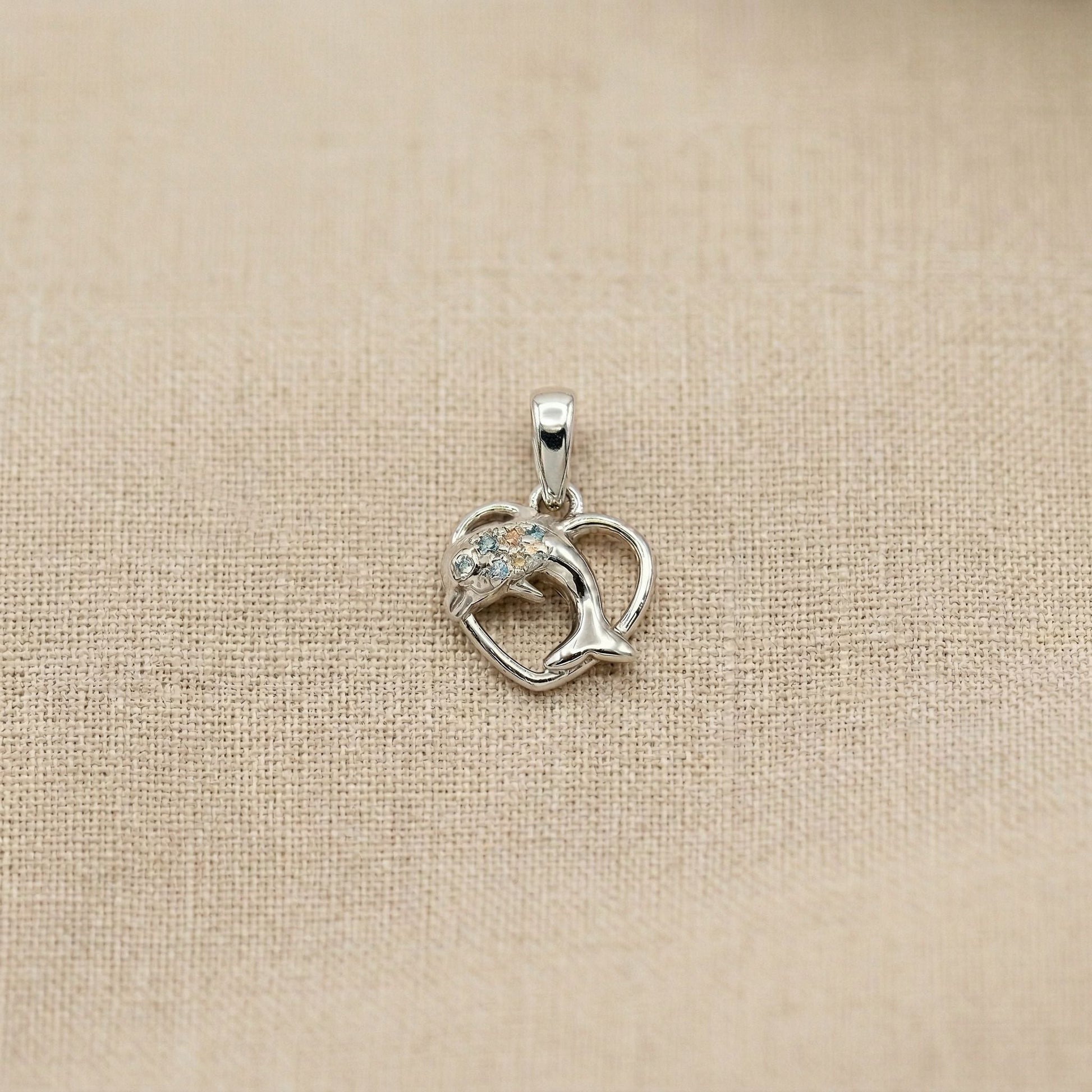 Smooth polished silver surface of the Silvme Dolphin Heart Pendant, premium 925 sterling silver