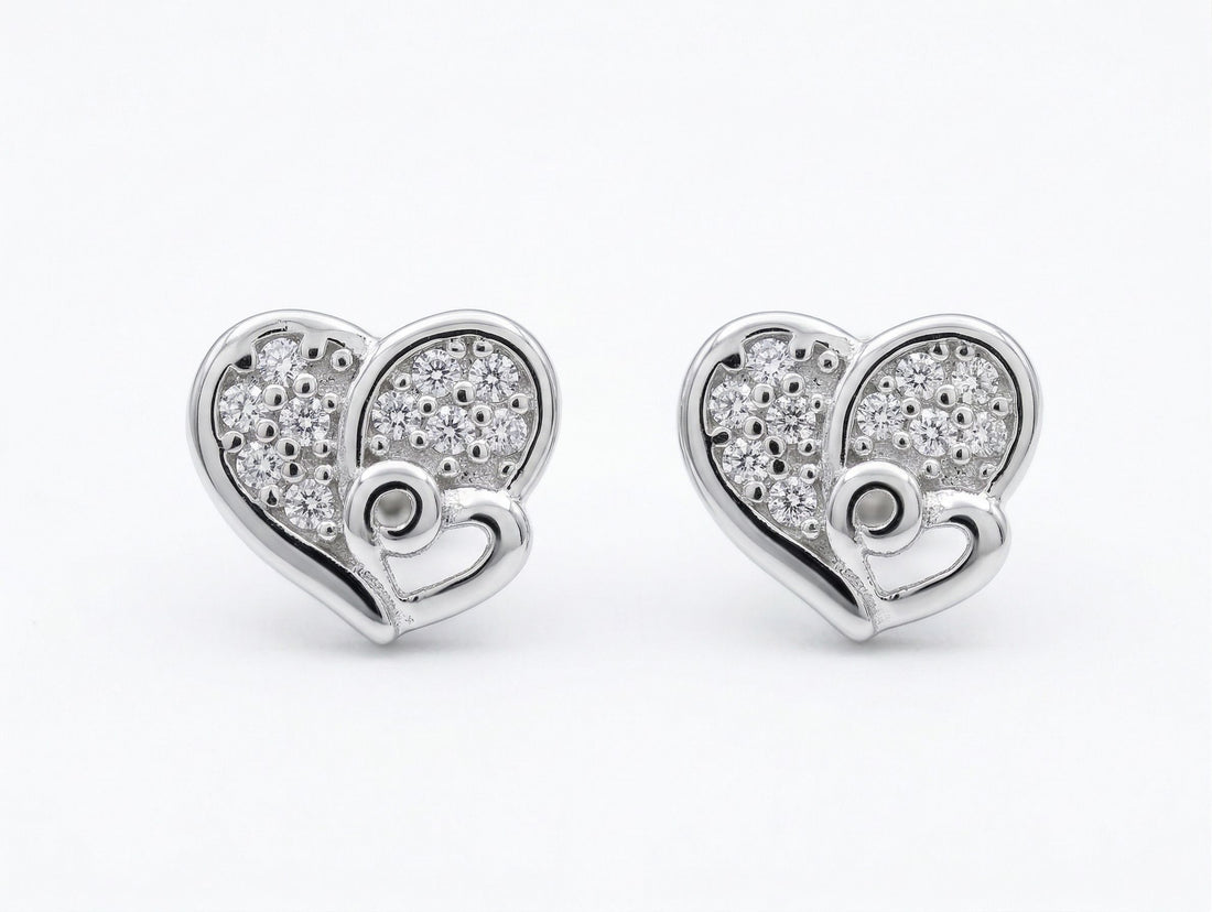 925 sterling silver Double Heart Pavé CZ Stud Earrings by Silvme accented with sparkling cubic zirconia, an elegant accessory for her
